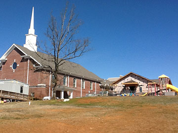 Two years after a tornado tore the steeple from Ford's Chapel United Methodist Church, Harvest, Ala., a new steeple beckons worshippers. A web-only UMNS photo by the Rev. Calvin Havens.