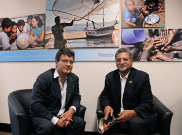 The Rev. Ivan Abrahams (right) and Thomas Kemper, shown here at the United Methodist Board of Global Ministries' office in 2011, praised Nelson Mandela's leadership. A UMNS photo by John C. Goodwin.