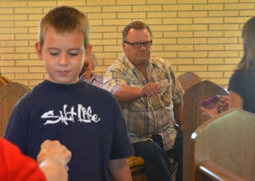 Children collect funds for school supplies and uniforms for local residents affected by Hurricane Isaac at Huff Chapel United Methodist Church in Killian, La.