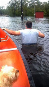 A man wades through flood waters in Mississippi. A web-only photo by Robert Sharp.