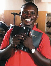 This smile shows the happiness felt by a man in the Democratic Republic of the Congo who is holding a Bible in his own language.