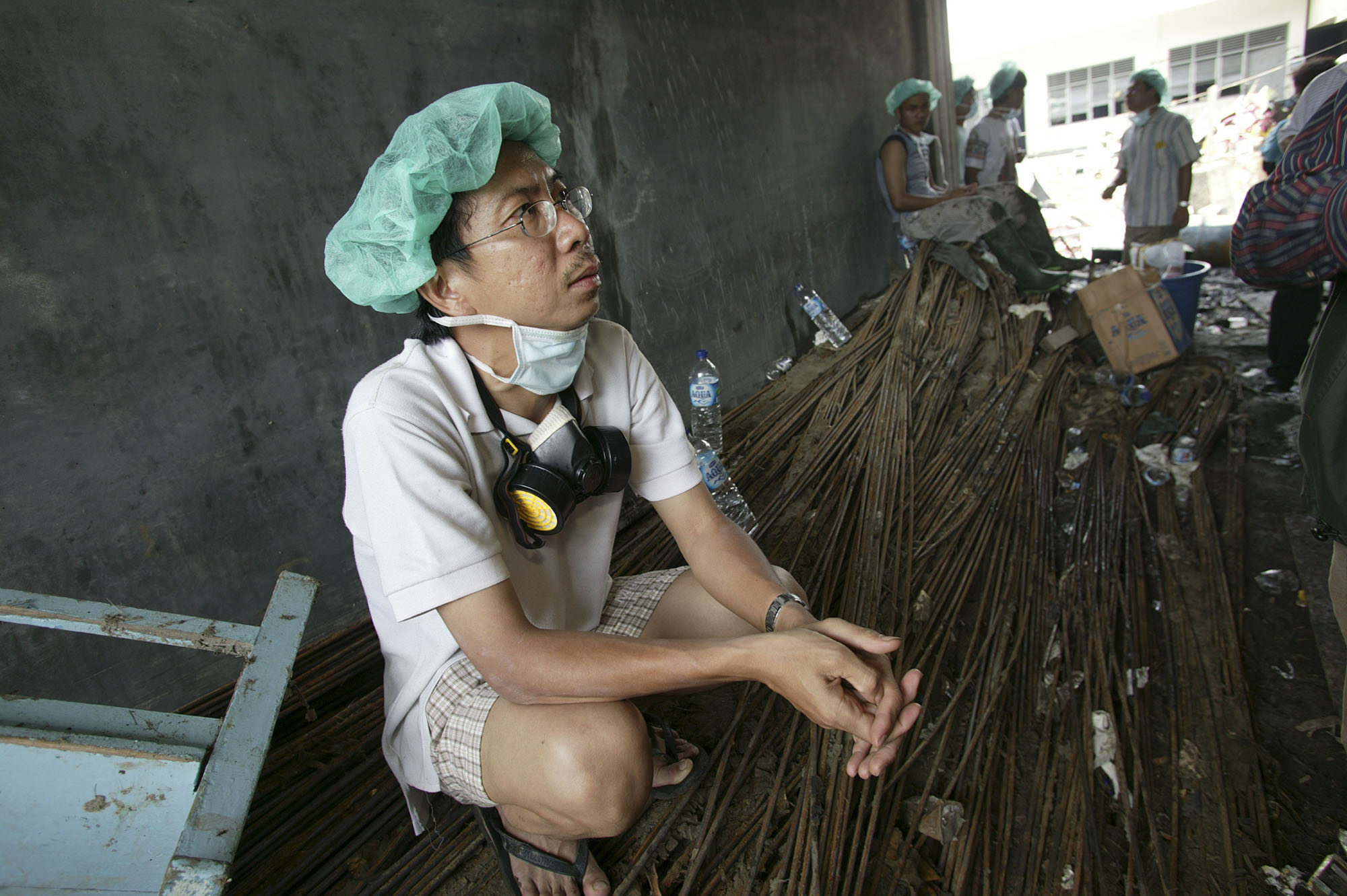  The Rev. Tahir Wijaya takes a break from cleanup duties at the church to recall how he survived the tsunami. A UMNS photo by Mike DuBose.