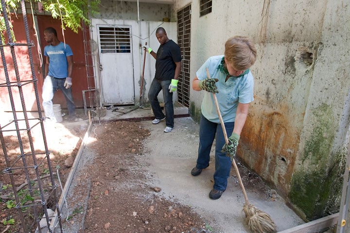 The Rev. Val Garron (right) of St. Paul United Methodist Church in Thorofare, N.J., volunteers with Haitians Jusner Mondesi (left) and Desir Jean Clairsant in Port-au-Prince, Haiti.