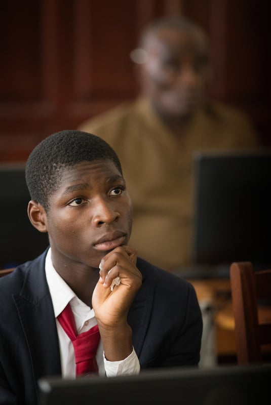 Alexandre Amani, a student at the Methodist University of Côte d'Ivoire in Abidjan, watches the animated video “Ebola: A Poem for the Living.” 