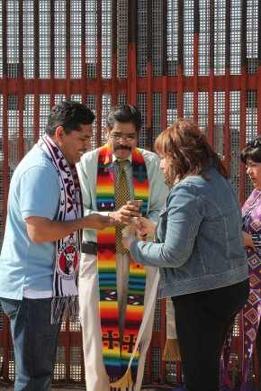 (From left) The Rev. Saul Montiel, Pastor Felipe Ruiz Aguilar and Bishop Minerva Carcaño share communion bread. United Methodist bishops from all over the world visit the U.S. - Mexico border to immerse themselves in the reality of life at the Southern border of the U.S. and sharpen their focus on how the church can be in ministry to persons residing there on May 7, 2013. A UMNS photo by Kathleen Barry.