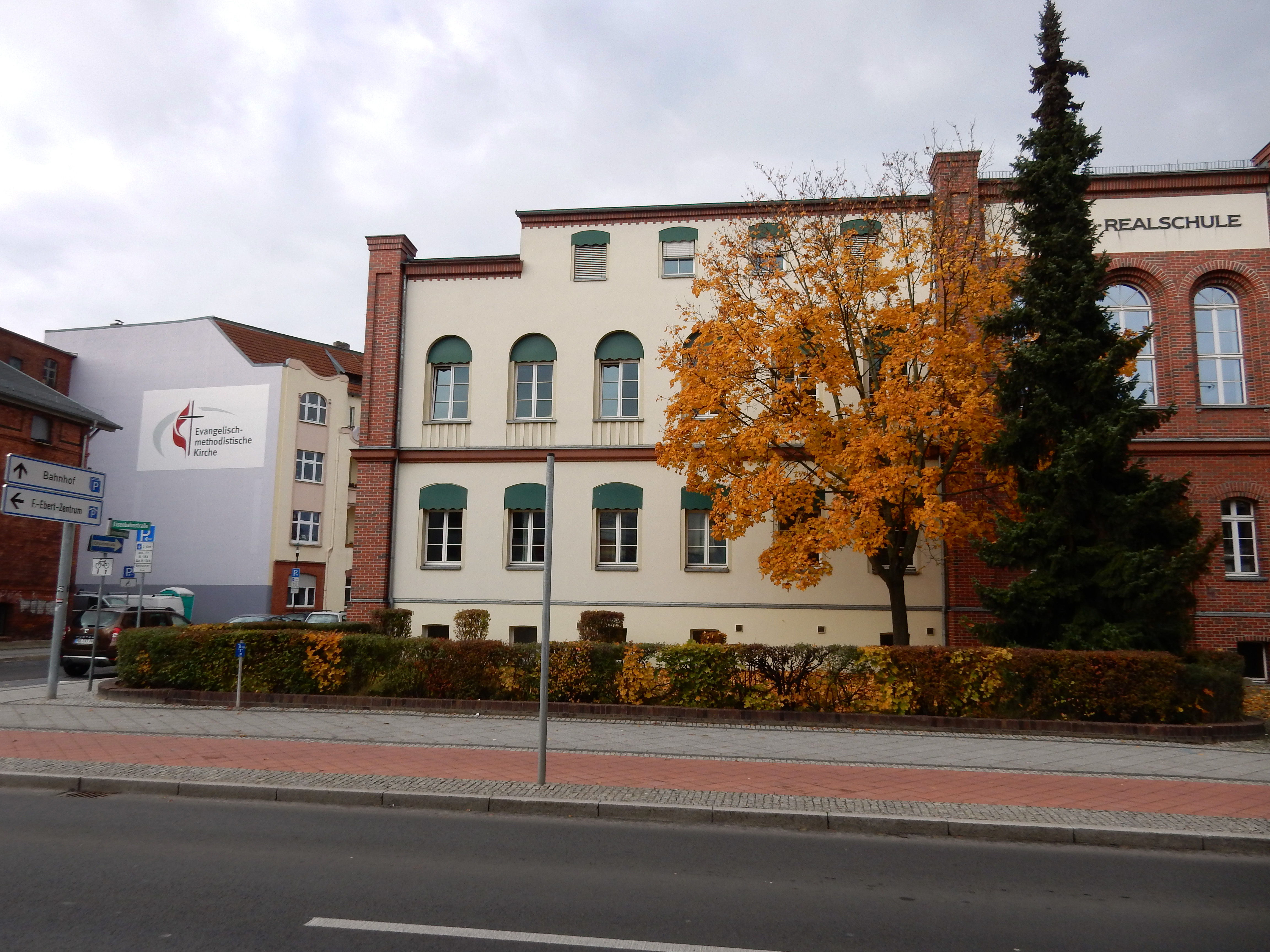 Immanuel United Methodist Church, at left, stands across the street in Eberswalde, Germany, from a former school that now serves as an emergency shelter for migrants seeking asylum. Photo by the Rev. Anne-Marie Detjen