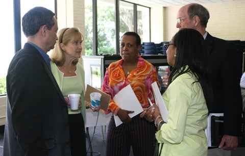 In 2010, the Council of Bishops and Connectional Table named a team of church leaders to reform agency structure. In this 2011 file photo, members of that team confer before addressing the Council of Bishops. Clockwise from left, team members pictured are Neil M. Alexander of the United Methodist Publishing House, laywoman Carol Tuthill of Ohio, laywoman Vicki Palmer, Ohio Area Bishop John L. Hopkins and laywoman Carolyn H. Byrd of Atlanta. File photo by Heather Hahn, UMNS