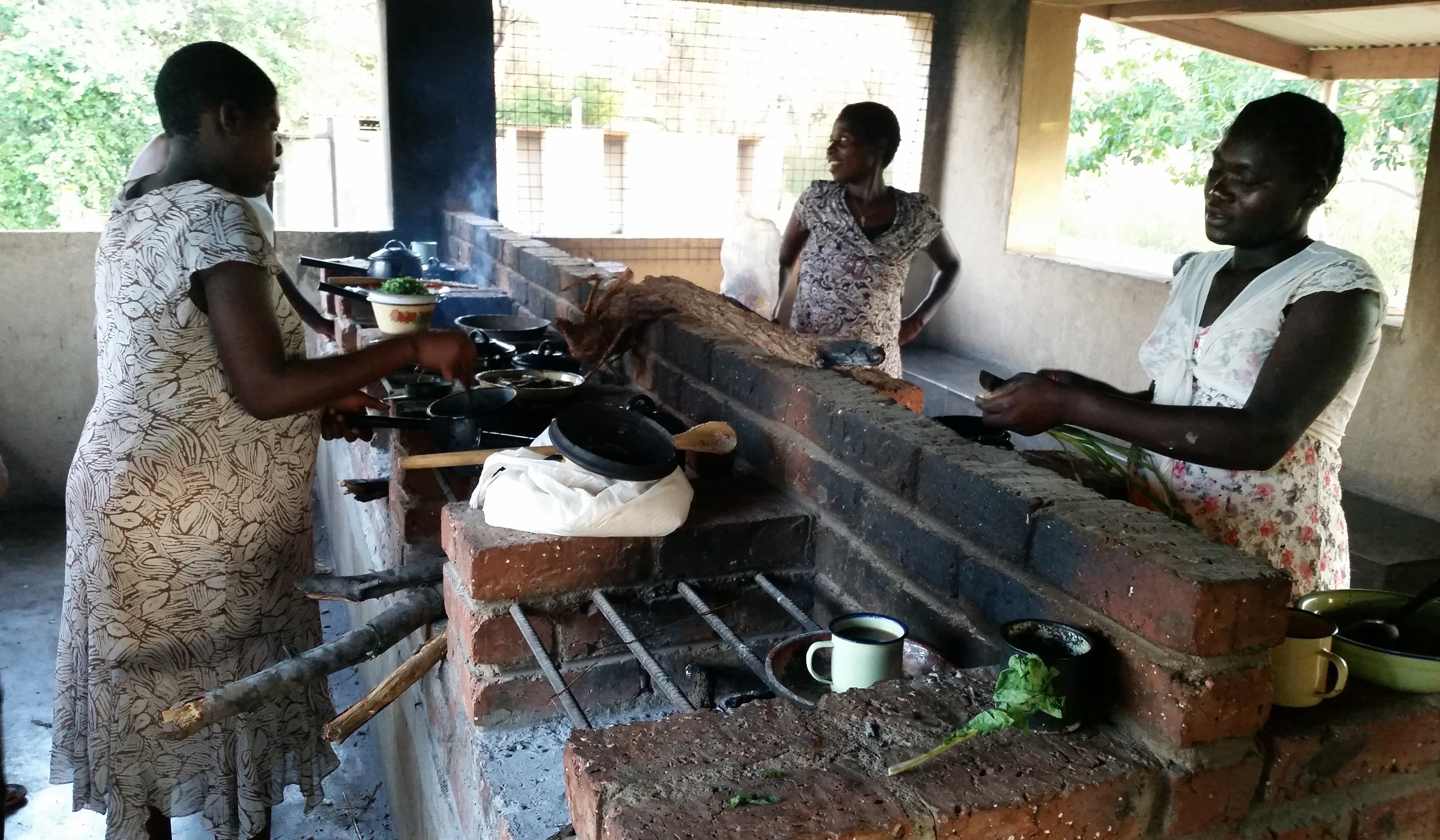 Expectant mothers prepare their evening meals in the kitchen at the United Methodist Nyadire Mission Hospital. Other meals are provided by the hospital. Photo by Eveline Chikwanah, UMNS