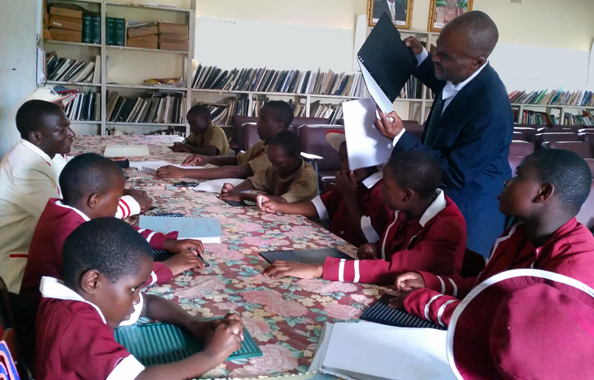 Daniel Chiomba and the visually impaired pupils at Murewa Central Primary School. Photo by Eveline Chikwanah, UMNS.