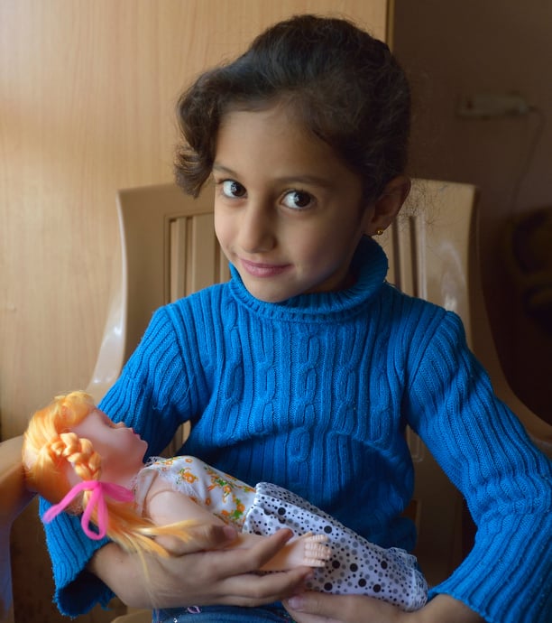 Rahaf Saeed, 6, a Yazidi girl displaced in 2014 by the Islamic State group, today lives with her family in the village of Kora, outside Duhok in the northern Iraqi region of Kurdistan. Photo © Paul Jeffrey.