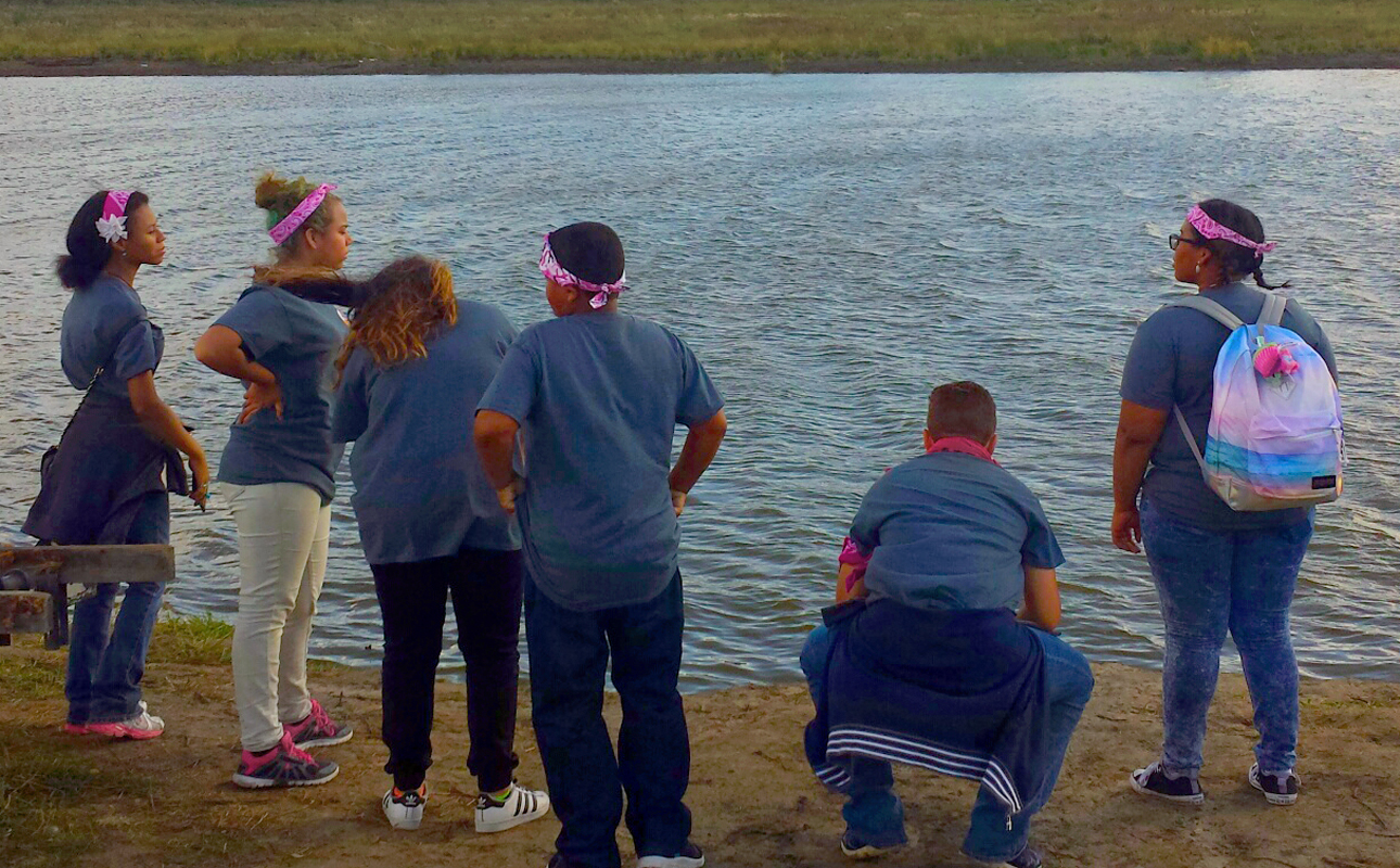 Students from Peg-Leg Flamingos, the Native American International Caucus’ youth leadership training program, gather to pray for the water during their visit to the Standing Rock Sioux campsite near Cannon Ball, North Dakota, in September. Photo courtesy of the Rev. Carol Lakota Eastin.