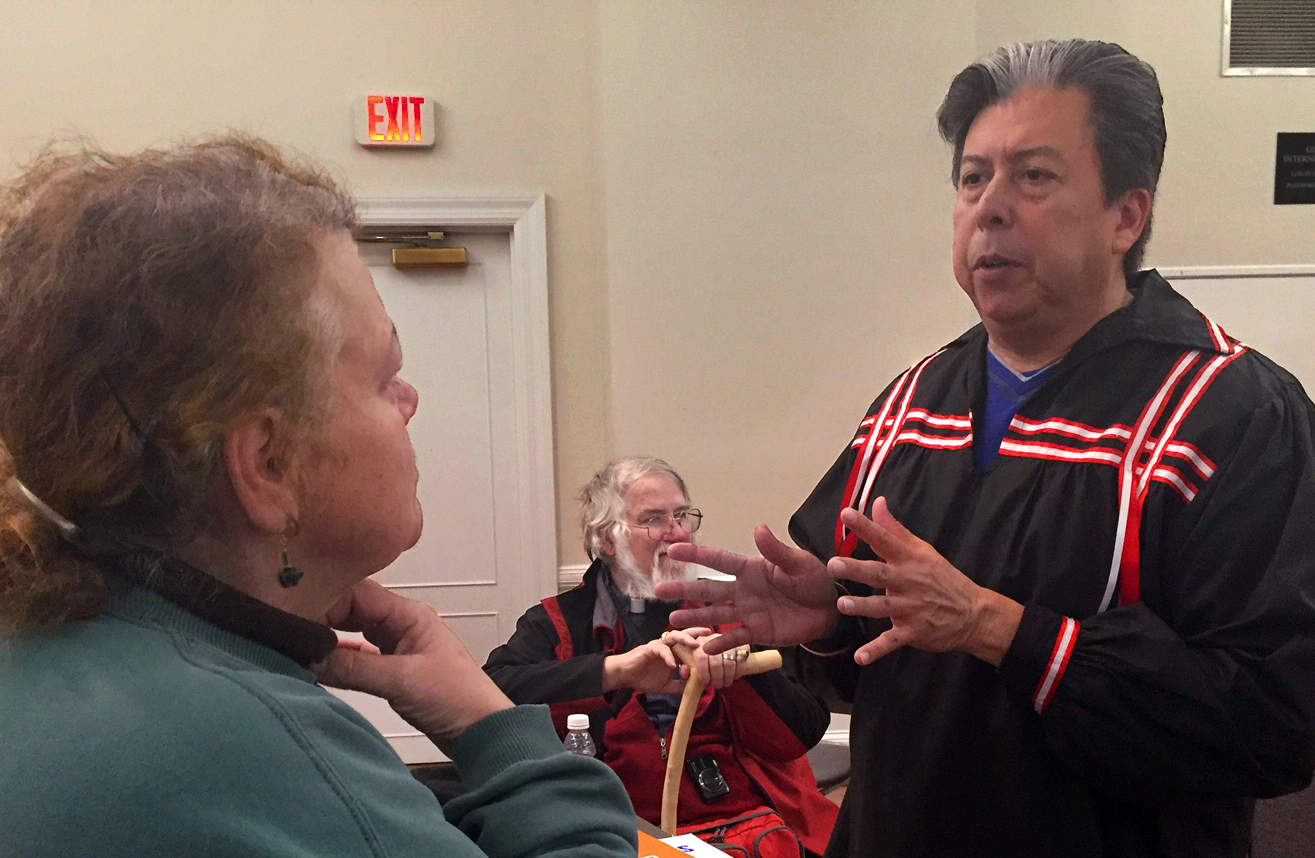 The Rev. David Wilson, superintendent of the Oklahoma Indian Missionary Conference, greets participants at the Methodist Building before the march. The conference has been working with protestors since last August, providing support during the nearly year-long encampment with supplies and money. Photo by Erik Alsgaard, UMNS.