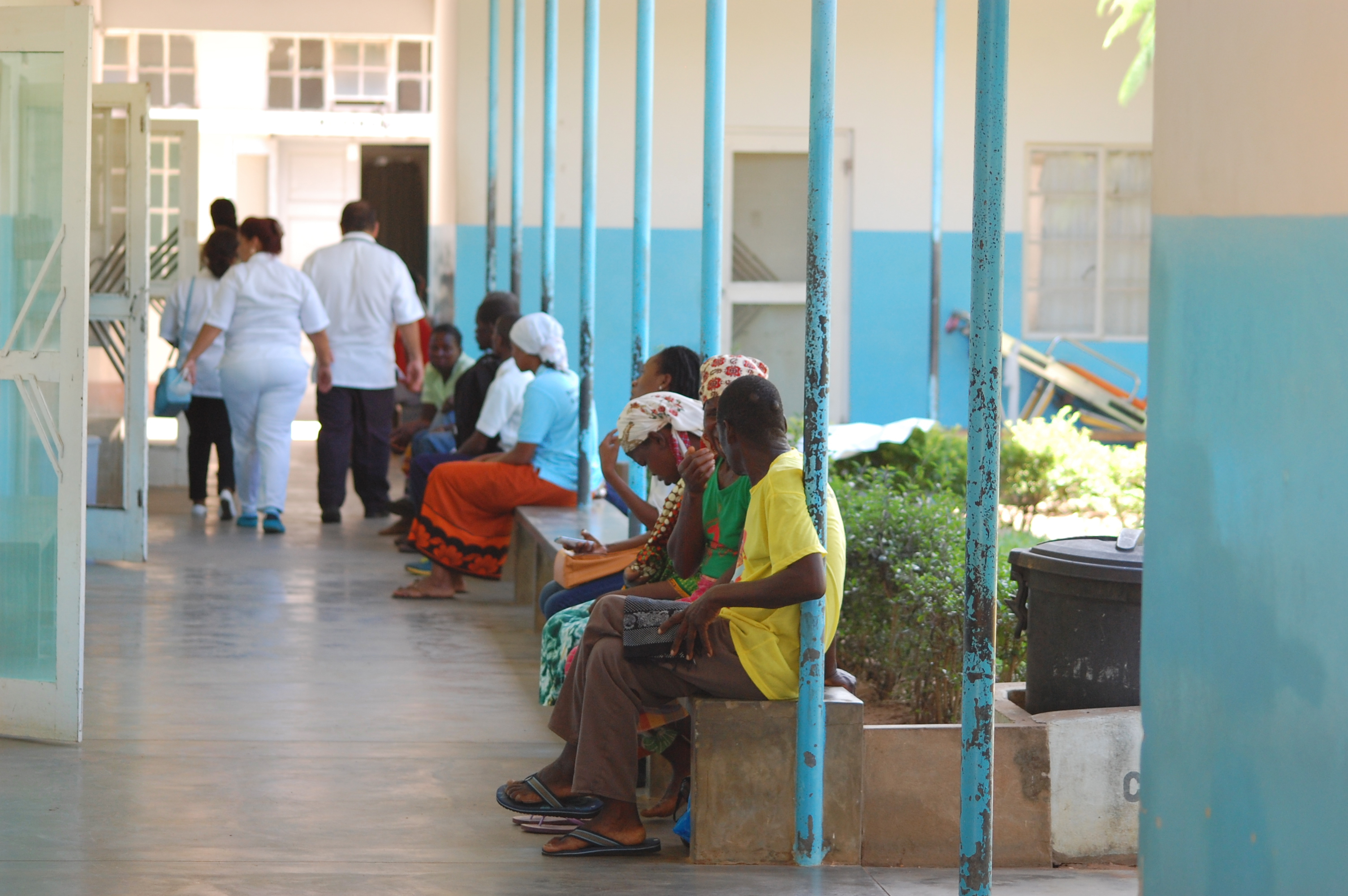 Men and women sit outside the maternity ward of the Chicuque Rural Hospital in Chicuque, Mozambique. Photo by Keeton Bigham-Tsai, Connectional Table.