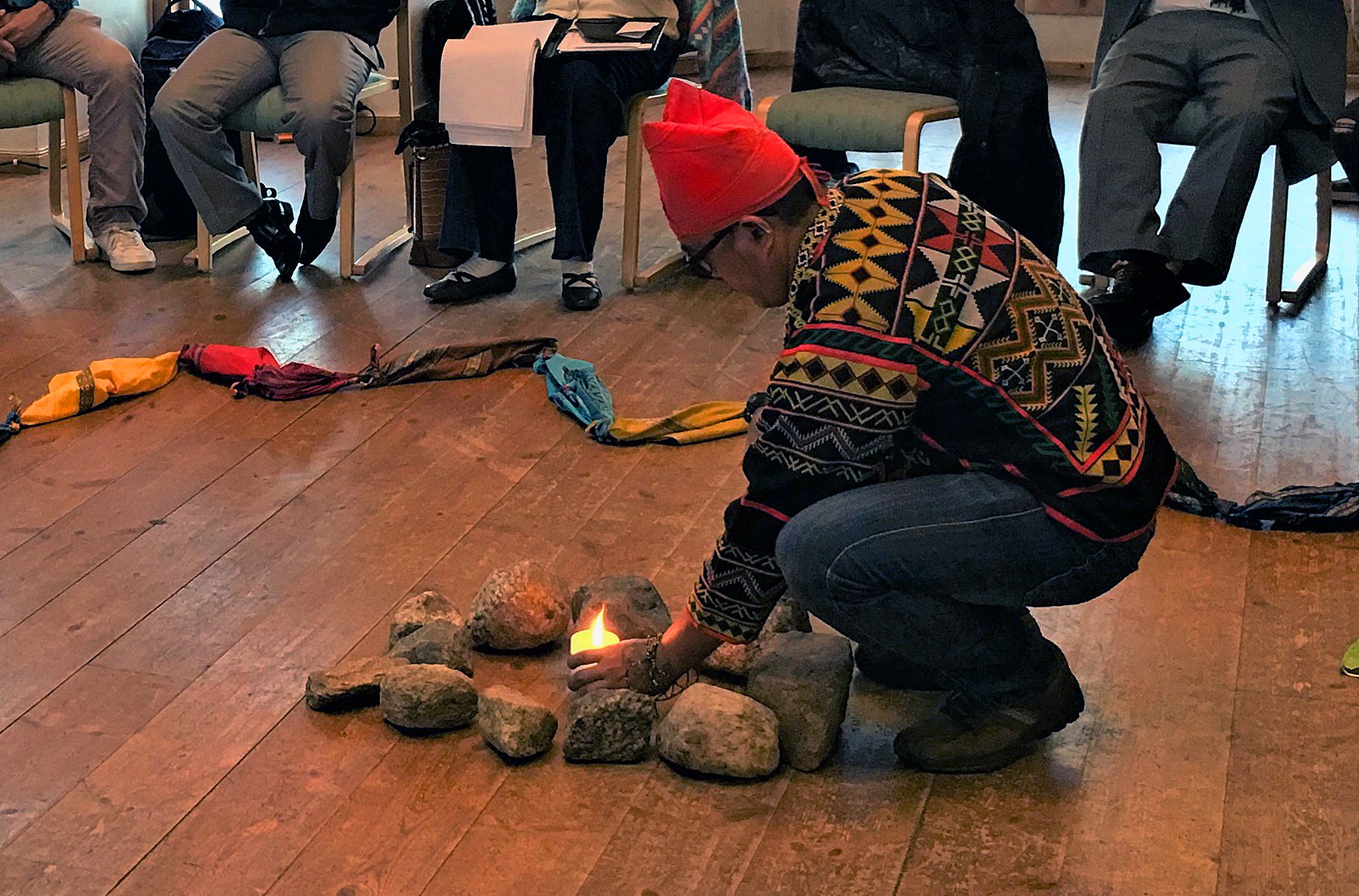 Close up of morning meditation during the gathering of indigenous peoples in Soltun, Norway, led by the Rev. David Wilson (not pictured), superintendent of the United Methodist Oklahoma Indian Missionary Conference. Photo courtesy of Levi Bautista.