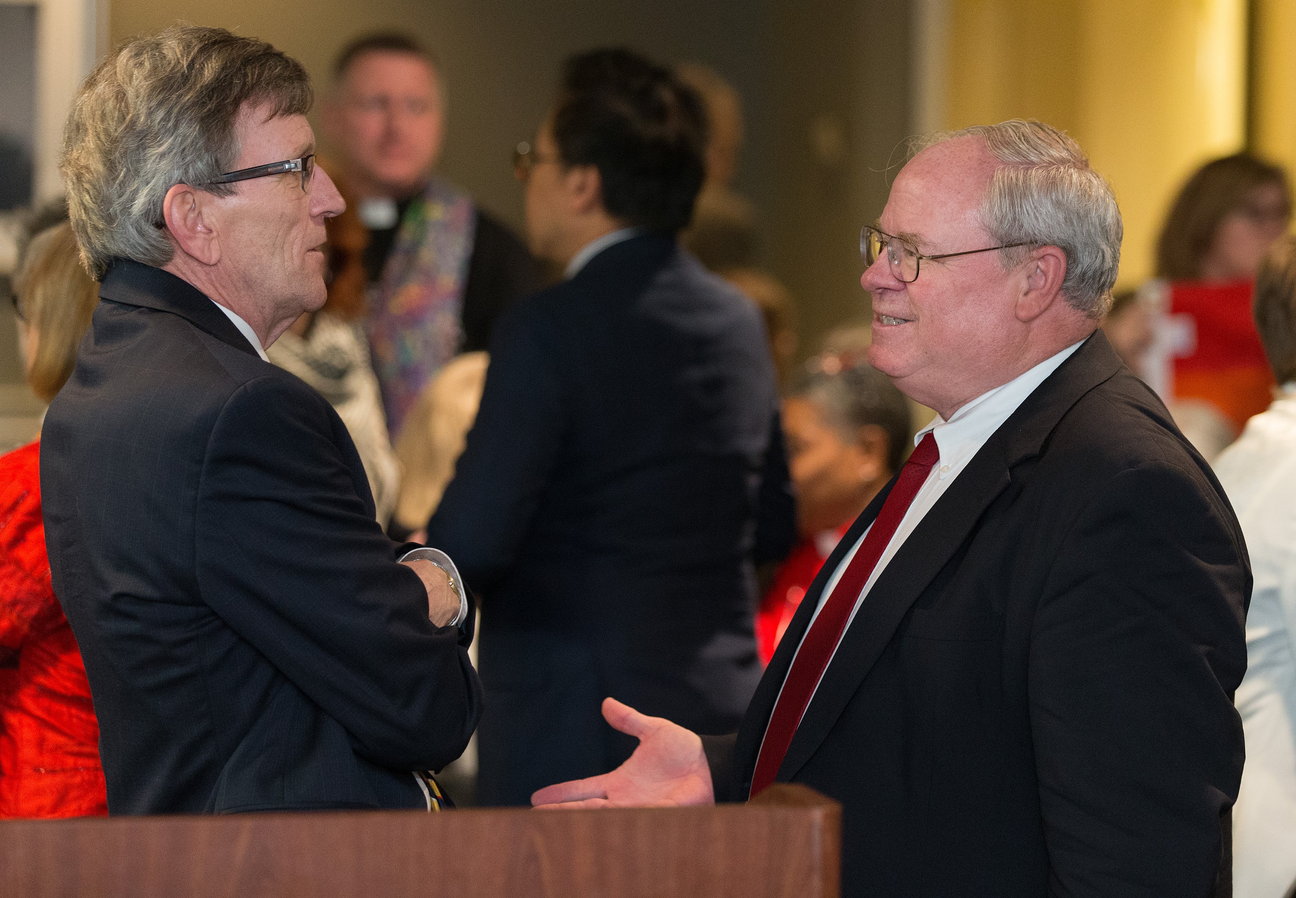 Richard A. Marsh (left) and the Rev. Keith Boyette visit one another after making oral arguments about whether a gay pastor can serve as a bishop in The United Methodist Church before the United Methodist Judicial Council, meeting in Newark, N.J., on April 25. The two argued opposite sides of the issue. Photo by Mike DuBose, UMNS.