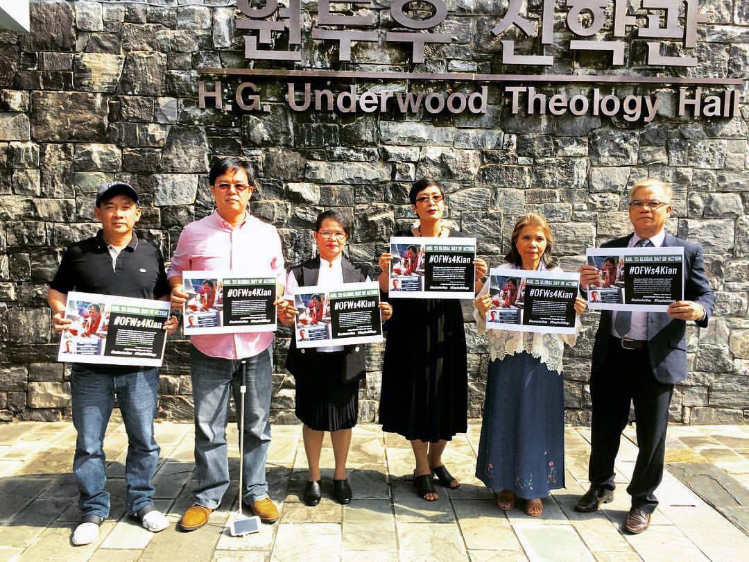 (Second from left) The Rev. Roland G. Annaguey, and (fourth from right) the Rev. Lizette Tapia-Raquel, United Methodist clergy studying at Yonsei University in Seoul, South Korea, joined a global action on Aug. 25, protesting extrajudicial killings under Philippines President Rodrigo Duterte. To date, there have been at least 12,000 victims, some of them as young as 5 years old. Photo courtesy of Lizette Tapia-Raquel. 