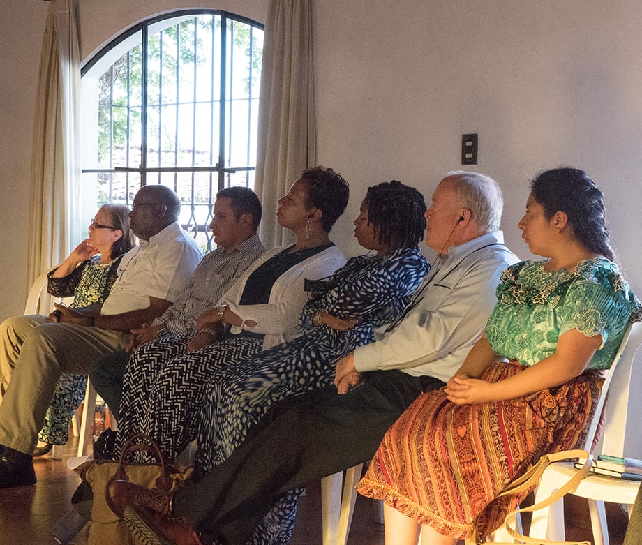 United Methodist bishops and members of the Evangelica Nacional Metodista Primitiva de Guatemala church listen to an overview of Guatemala and Methodism at Santo Tomas Hotel in Chichicastenango, Guatemala. 