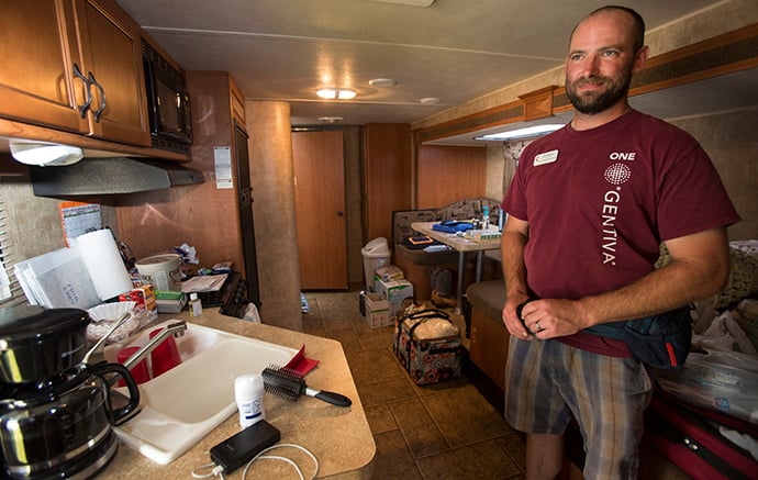 The Rev. John Mooney, pastor of First United Methodist Church in Vidor, Texas, is living with his wife and two young children in a donated camper. HIs home was damaged from flooding resulting from Hurricane Harvey. Photo by Kathleen Barry, UMNS.