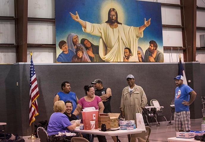 Nurse Ruth Hanson from Winnie, Texas gives tetanus shots inside the gym at First United Methodist Church in Vidor, Texas. Photo by Kathleen Barry, UMNS.