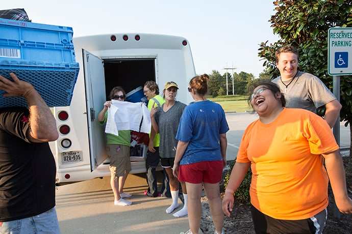 The work crew from First United Methodist Church in Carthage, Tenn. rejoices at the end of a day mucking out homes damaged by flooding from Hurricane Harvey. In Orange, Texas. Photo by Kathleen Barry, UMNS.