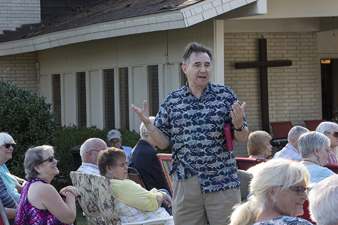 The Rev. Frank Coats, pastor of Lake Houston United Methodist Church in Huffman, Texas, leads the outdoor Sunday service. Photo by Kathleen Barry, UMNS.