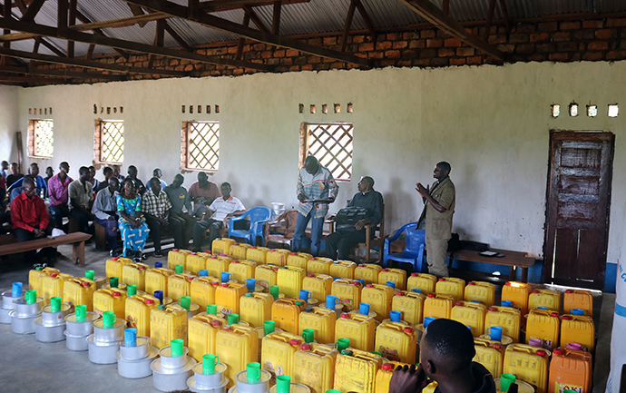 The Rev. Augustin Bosenga, superintendent for the Kasongo-Samba District, preached at a ceremony that included a word of thanks for the local chief of Samba. Earlier, the church team visited the chief to extend their appreciation and brief him about their activities. Supplies to be distributed are stacked in the church building. Photo by Judith Osongo Yanga, UMNS.