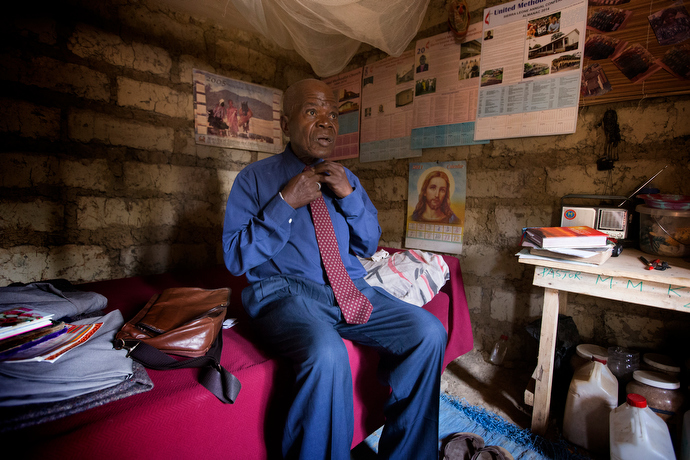 United Methodist Pastor Moses Sandy prepares to leave from his home near Kortihun village, outside Bo, Sierra Leone, for the first of two churches he will lead in worship in 2014. File photo by Mike DuBose, UMNS.