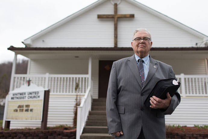 The Rev. Earl Bible stands outside Whitmer United Methodist Church in Seneca Rocks, W.Va., in 2015. File photo by Mike DuBose, UMNS.