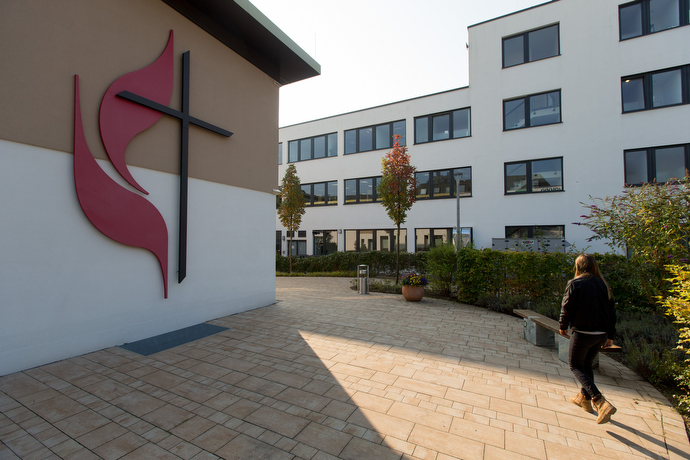 A parishioner arrives for worship at the United Methodist Church of the Redeemer in Munich, Germany. Photo by Mike DuBose, UMNS.