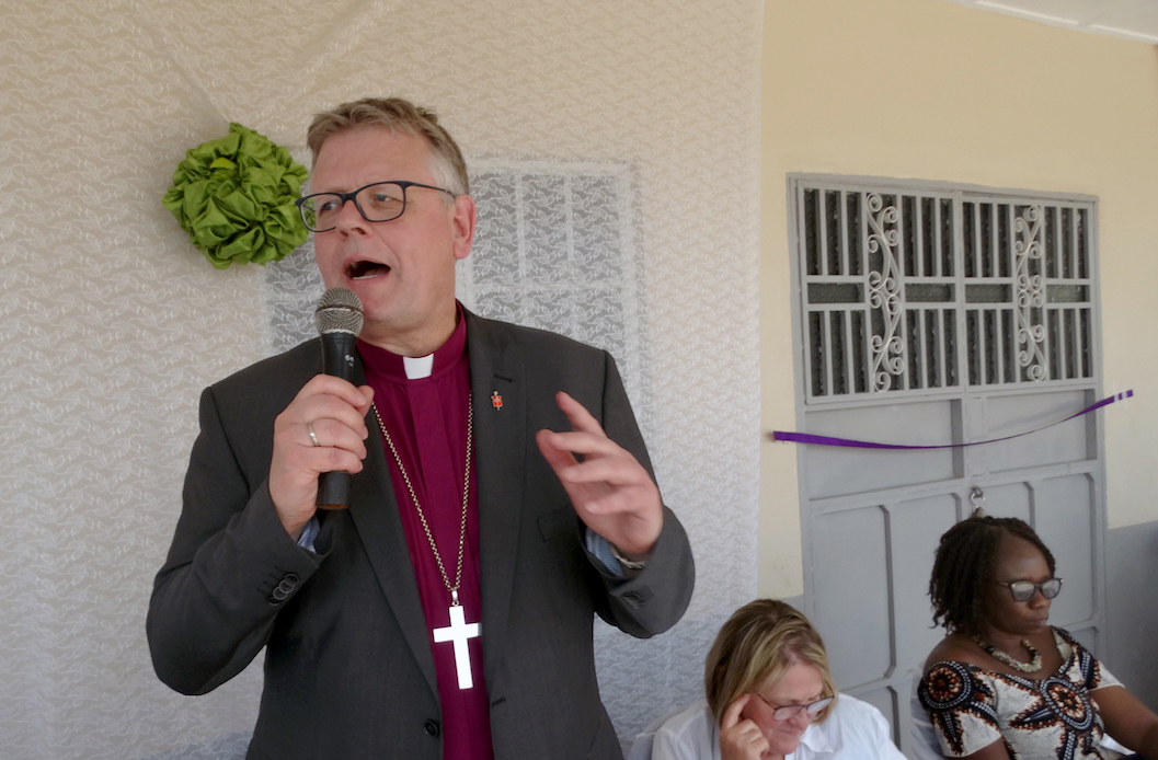 Norwegian Bishop Christian Alsted of the Nordic-Baltic Episcopal Area prays for the new health center and the people of Joyah, Sierra Leone. Photo by Phileas Jusu, UMNS.