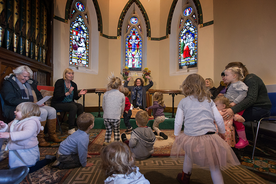 The Rev. Katy Thomas (rear) presides over a 