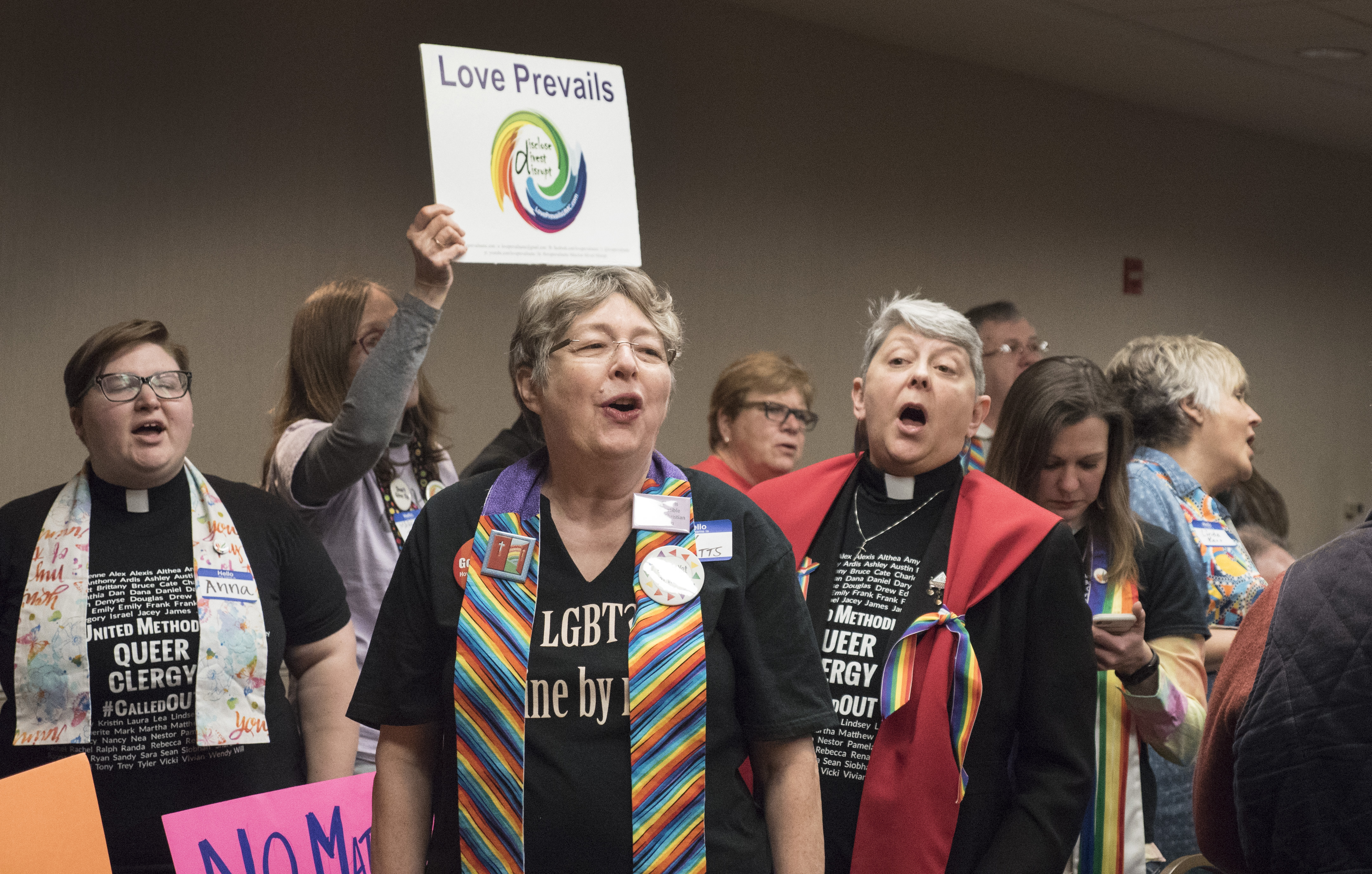 Supporters for the Rev. David Meredith sing at the end of the hearing concerning which charges the Ohio elder faces for his 2016 marriage to another man. Photo by Kathy L. Gilbert