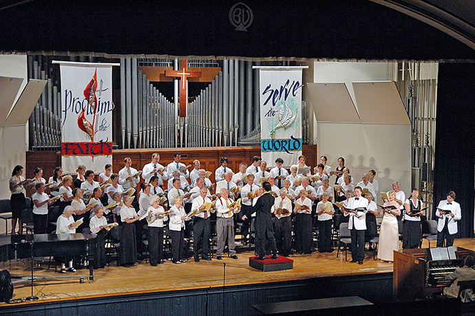 Sunday evenings at Bay View, a United Methodist-affiliated summer community in northern Michigan, include vespers, with a choir and other musicians. Bay View faces internal struggles, including a lawsuit, over its policy of restricting cottage ownership to Christians. Photo courtesy Bay View Chautauqua Inclusiveness Group.