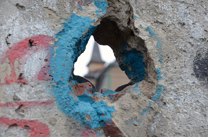 A hole in the Berlin Wall on the former east side at the Berlin Wall Memorial Bernauer Strasse shows the steeple of a building on the other side. The United Methodist Board of Church and Society chose Berlin for their conference March 15-18 partly because the formerly divided city stands for upheaval and reconciliation. Photo by the Rev. Klaus U. Ruof.