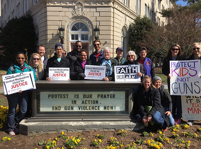 Bishop LaTrelle Easterling, the episcopal leader of the Baltimore-Washington Conference (center), along with other members from Foundry United Methodist Church in Washington, stand in front of the United Methodist Building before the rally. Photo by Sheila George.