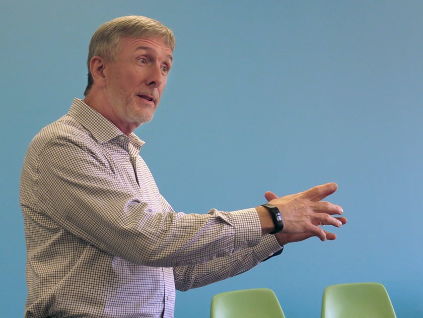 Jonathan Bell speaks on United Methodist microfinance efforts at the Beyond These Walls mission conference. Photo by Sam Hodges, UMNS.