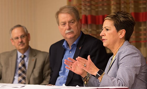 Bishop Cynthia F. Harvey (right) answers questions during a press conference about the United Methodist Church's Way Forward plan to address how the denomination ministers with LGBTQ individuals at the conclusion of the church's Council of Bishops meeting in Chicago. She is flanked by Bishops Bruce R. Ough (left) and Kenneth H. Carter. Photo by Mike DuBose, UMNS.