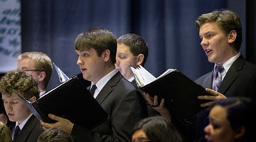 Andy Wegg, right, sings in the choir during the March 21, 2013, inauguration of University of Indianapolis president Robert Manuel. A UMNS photo by Mike DuBose.