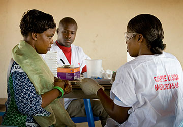 Cecile Ahimin Aya (left) has an HIV test during a public health screening at the Jerusalem Parish United Methodist Church in Yamoussoukro, Côte d'Ivoire, in November 2008.