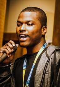 Student Michael Brown sings during the