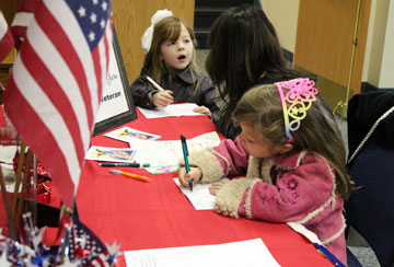 Children at First United Methodist Church, Lancaster, Pa., write thank-you notes to wounded veterans and active troops in the military. A UMNS photo by Gwen Kisker.