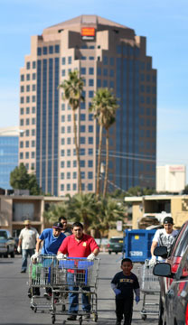 Volunteers for Impact Las Vegas 2013 help clean up the Palos Verdes neighborhood near the Las Vegas Strip. A UMNS photo by Joey Butler.