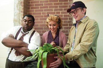 Wegg has settled into college life. Here, at right, he is cast in the school production of