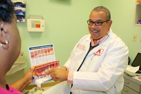 Dr. Kenneth Williams discusses a medical issue with a visitor to his rural Mississippi clinic.   Web-only photos by Lee Eric Smith.