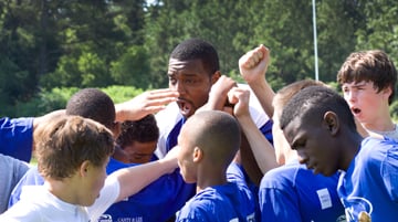 NFL football player Chris Canty started the Chris Canty Camp of Champions Football Camp, which encourages children and youth to strive to do their best. A web-only photo courtesy of the Chris Canty Foundation.