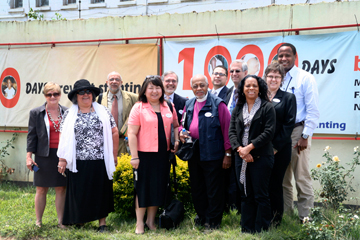 June Kim of the United Methodist Committee on Relief (center, in peach jacket) and others visited three African countries last October as part of a trip sponsored by Bread for the World related to the 