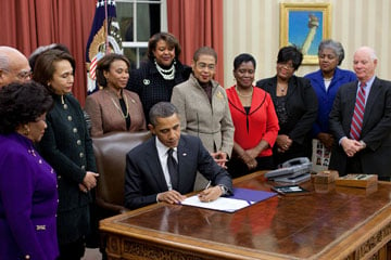 President Barack Obama signs H.R. 6118, the 