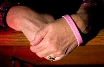 Mamie Jeter wears a wristband proclaiming 