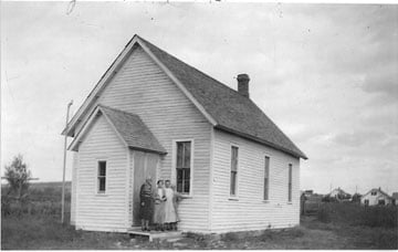 Congregants gather outside of the Methodist Episcopal Church in Gladstone, N.D., in this circa 1933 photo. A UMNS photo courtesy of the Archives of the Dakotas Conference of the United Methodist Church.