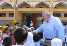 The Rev. Sam Dixon greets children in Indonesia in this file photo.A Web-only photo courtesy of UMCOR.